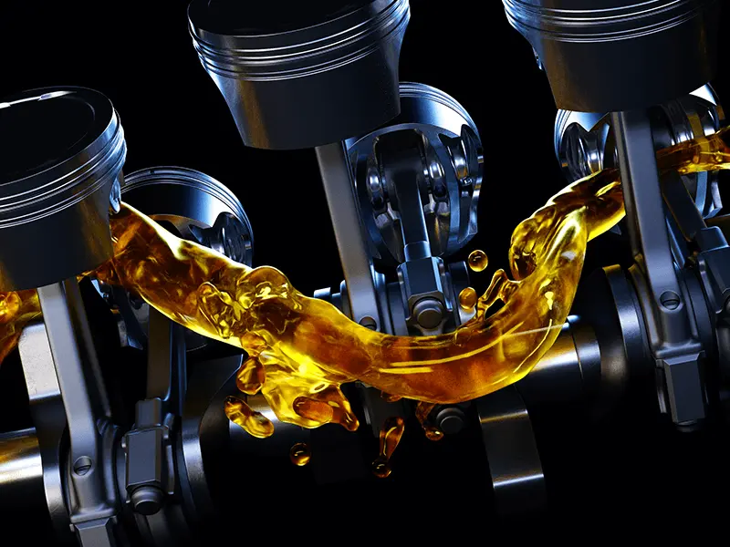 Oil floating between engine pistons